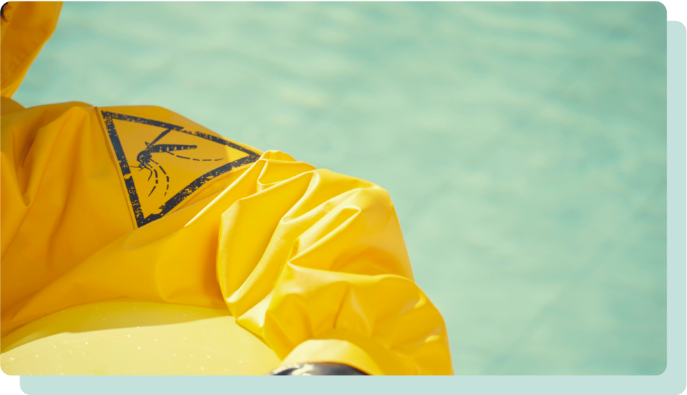 Person wearing hazmat suit in pool on vacation for protection in high-risk chikungunya destination.