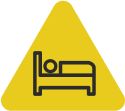 Icon showing person sleeping in bed to recover from chikungunya.