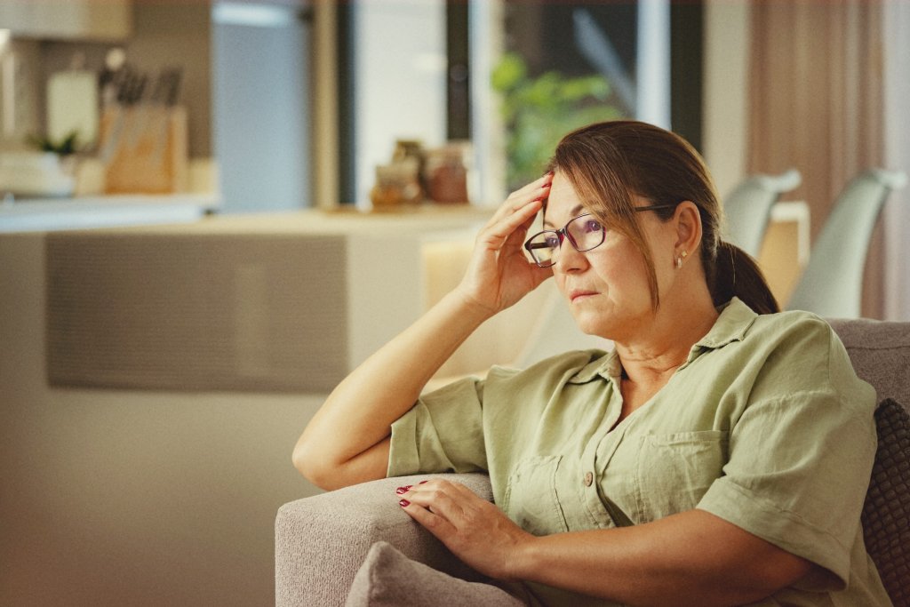 Woman exhibiting a common symptom of chikungunya, extreme tiredness.